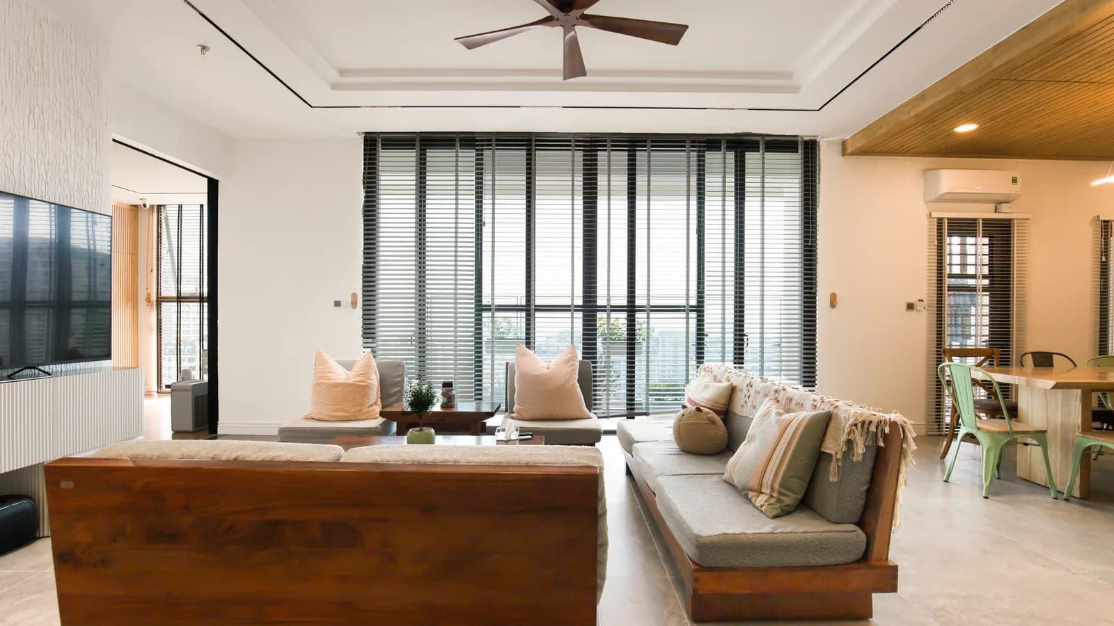 Ceiling fan viewed from below above a living room sofa