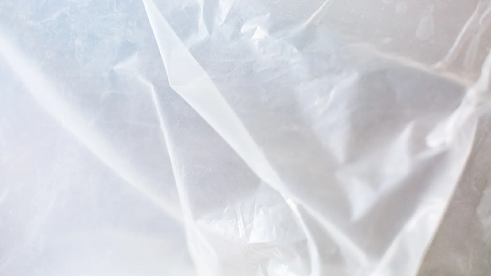 Close-up of transparent plastic sheeting used for covering surfaces during home renovation work.