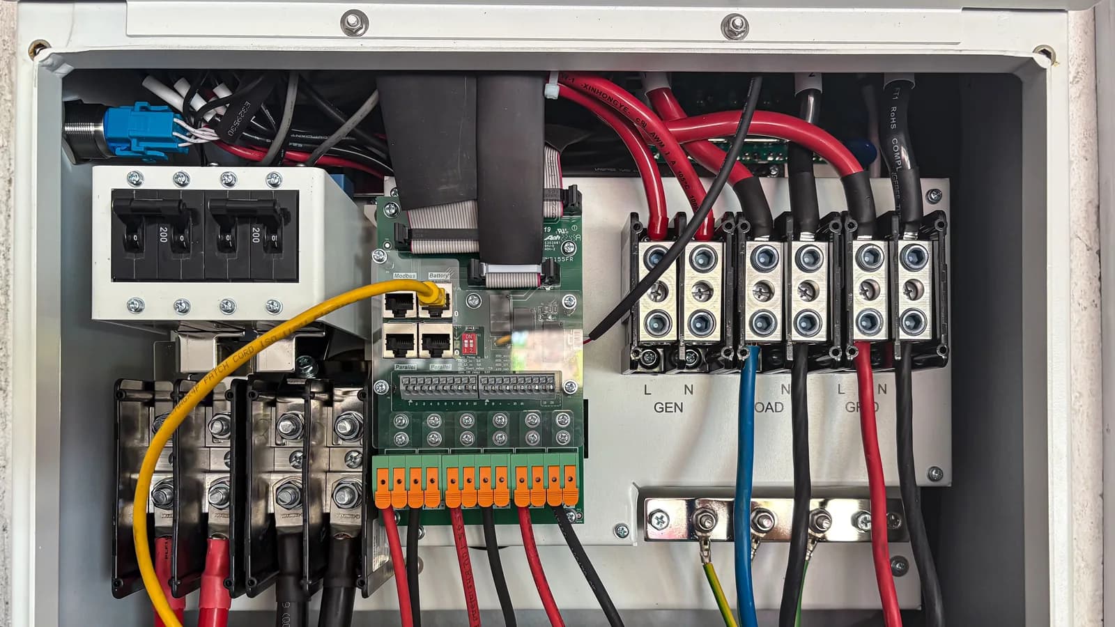 Inside view of an electrical control panel showing circuits and connections.