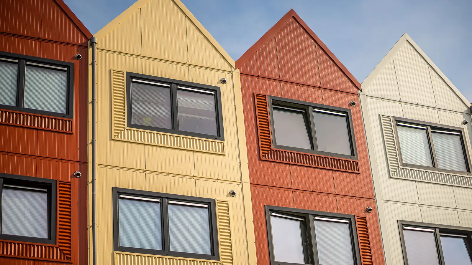 Vibrant apartment facades with distinct designs and colors.