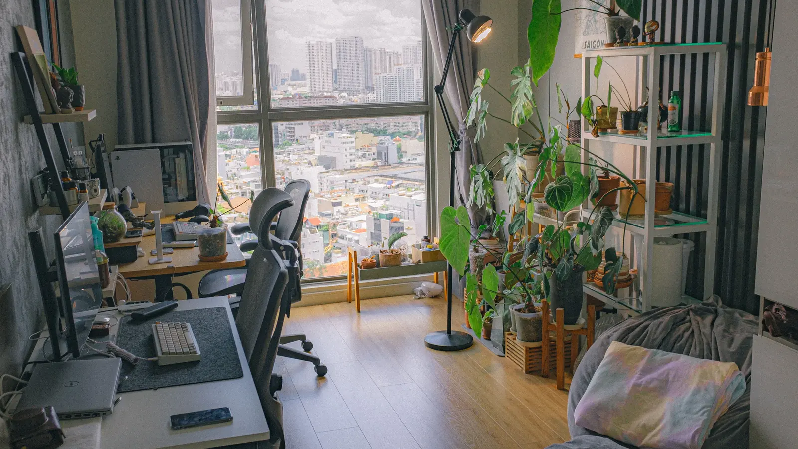 Compact desk and chair arranged as a home office in the corner of a shared living room