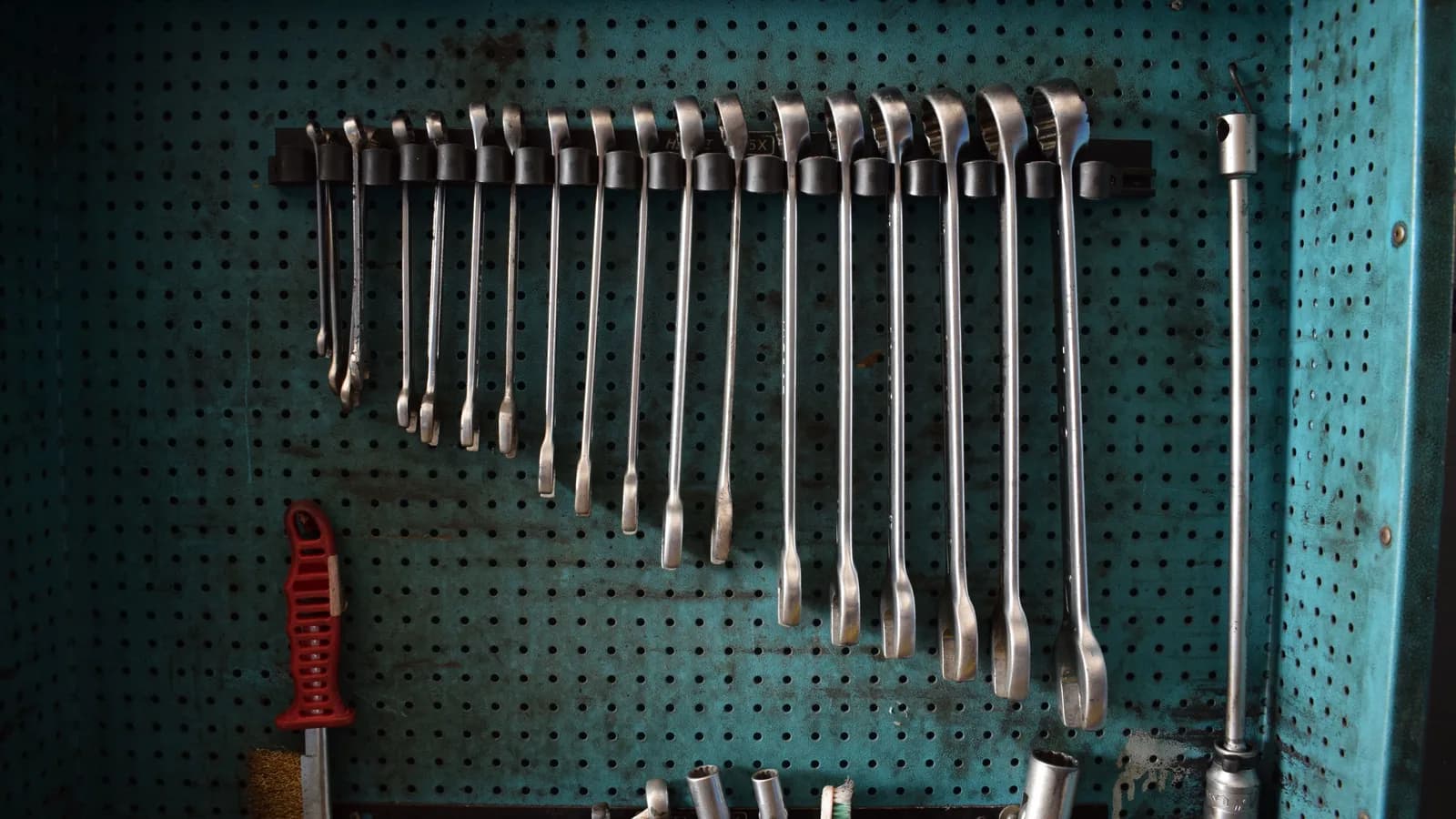 An organized garage tool wall with open floor space for parking