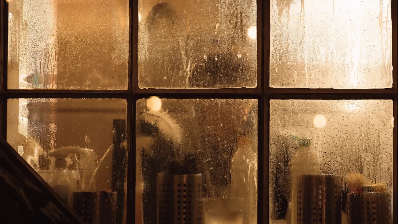 Water droplets covering the inside surface of a cold residential window