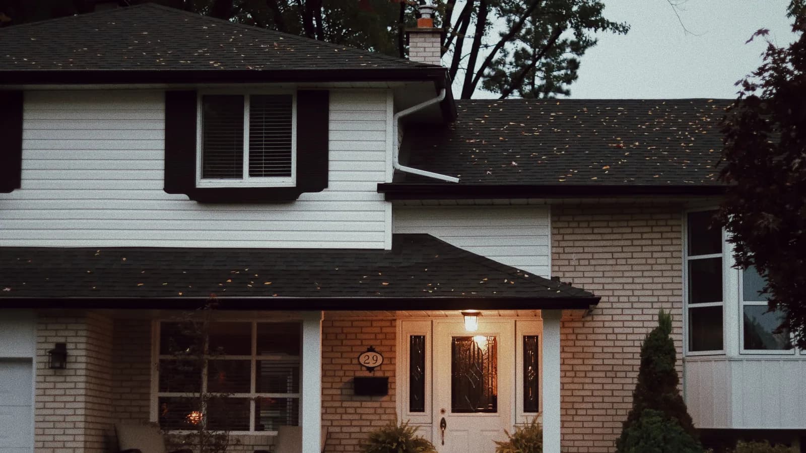 Exterior entry door on a suburban home with a covered porch